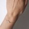 armbandje met voetje baby in het goud